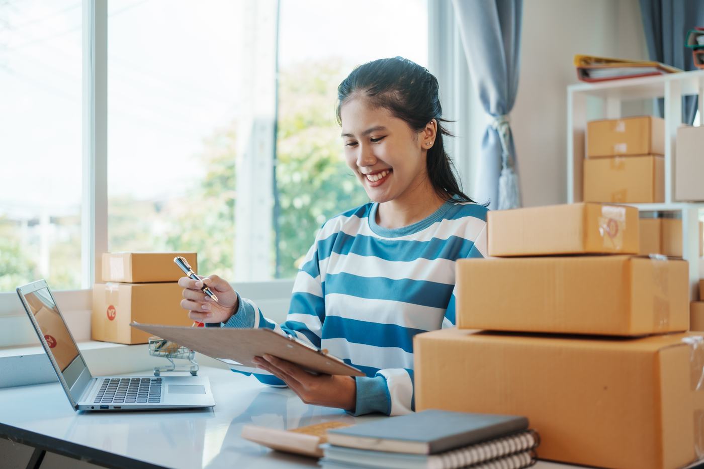 Small business owner managing orders
